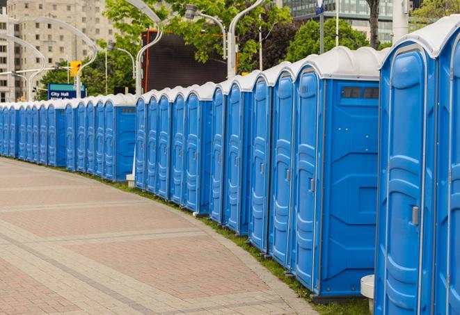 a row of portable restrooms at a fairground, offering visitors a clean and hassle-free experience in Derby